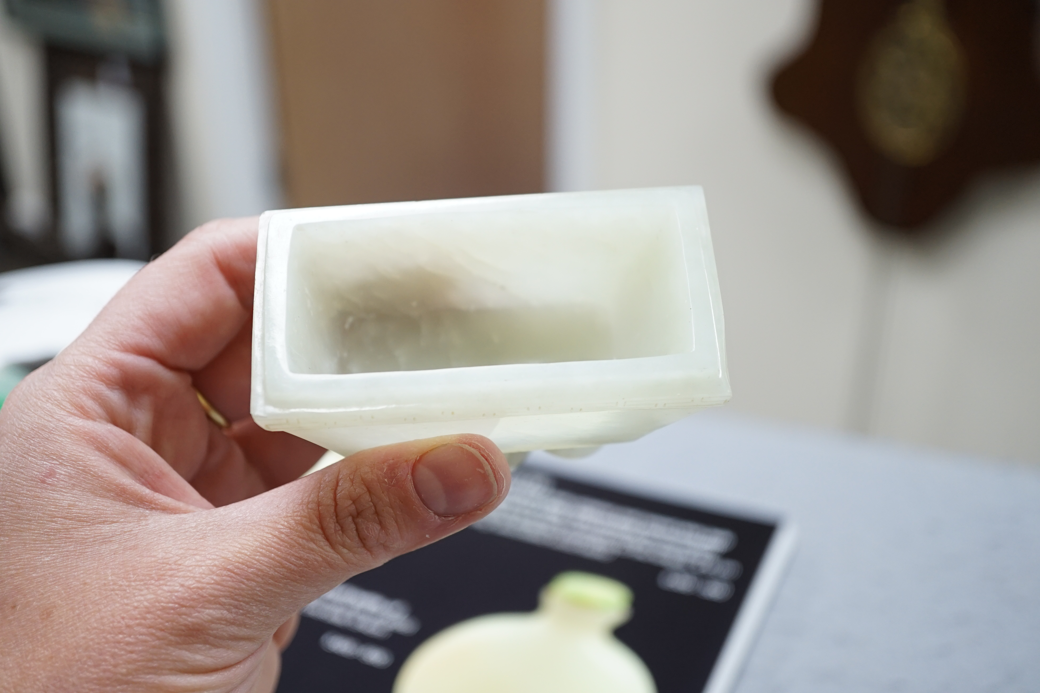 A Chinese pale celadon jade rectangular vase and cover, 19th/20th century
